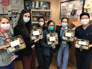 Health care workers at Columbia Presbyterian Hospital receiving the bento boxes