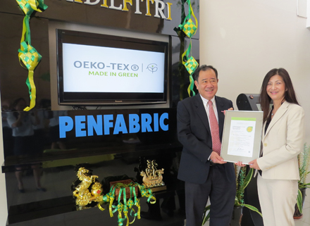 HS Teh, PAB Managing Director, receiving the certificate from Ms. Cynthia Lum, representative of TESTEX, the independent Swiss testing and certification institute appointed by OEKO-TEX® to carry out the audit at PAB