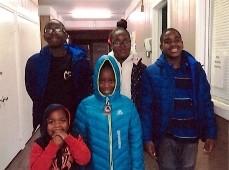 Children wearing winter coats donated from associates at CMA Spartanburg Plant and the Spartanburg Housing Authority