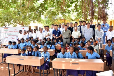 Students of the school receiving the desks and representatives of the Japanese companies from Sri City Industrial Site