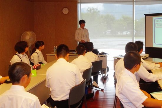 Miyazaki (center, back) delivering the lecture