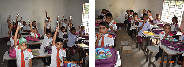 Pre-class students of Haji Ismail Hossain Public school enjoying the distributed cookies