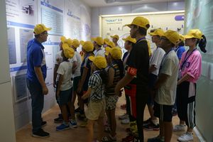 The participants listening intently to introduction of the company by an employee