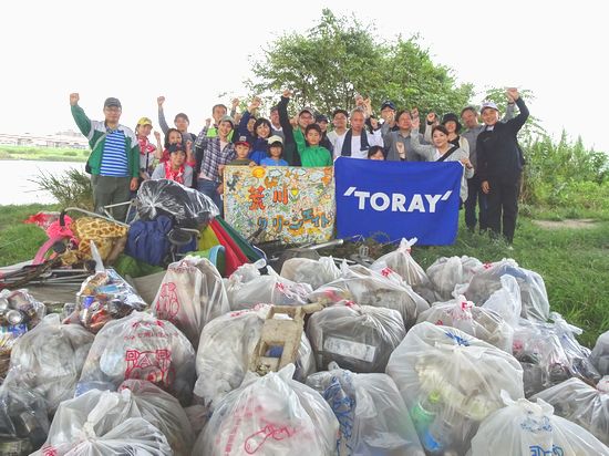 Volunteers in front of the trash they collected