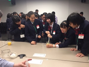 Students try out water filtration experiments