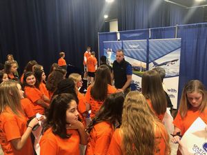 Production Senior Manager Frank Crisp attends to many students visiting CMA booth