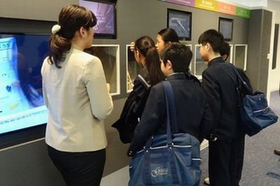 Ginza Junior High School students looks at displayed Toray Group products