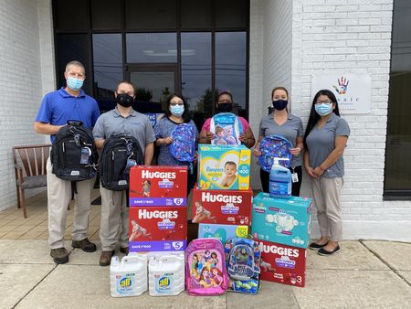 Donation items to Hope Place with Hope Place staff and Decatur Plant team members
