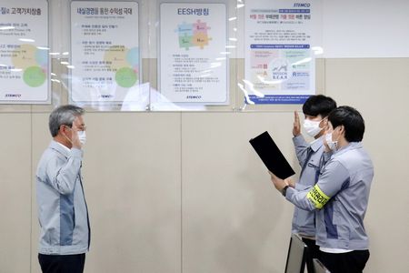 Oum (left) and the employees delivering the safety declaration