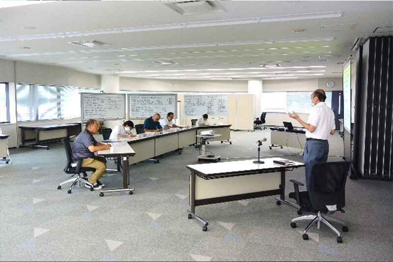 Teachers listening to a lecture on human resource development
