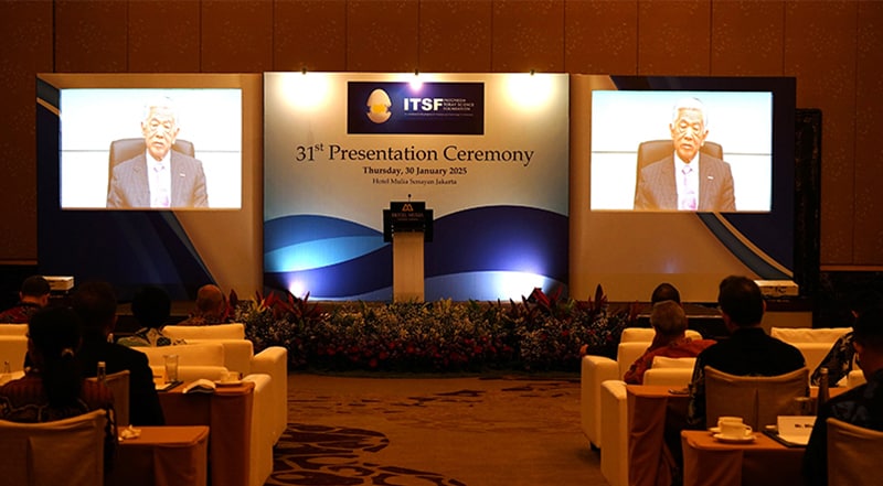 ITSF Honorary Chairman and Toray Industries Chairman of the Board Akihiro Nikkaku delivers a speech via video message